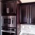 black cabinets stainless steel